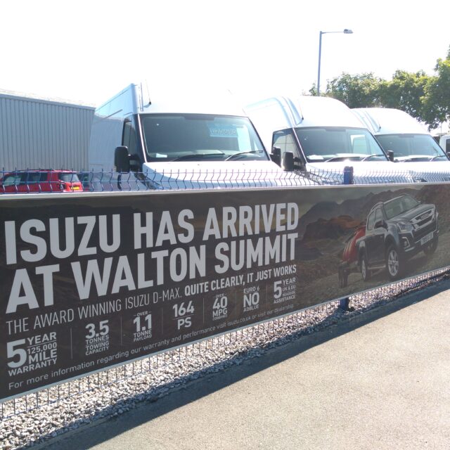 Road side fence banner system made for Walton Summit built by BuildingSkinz